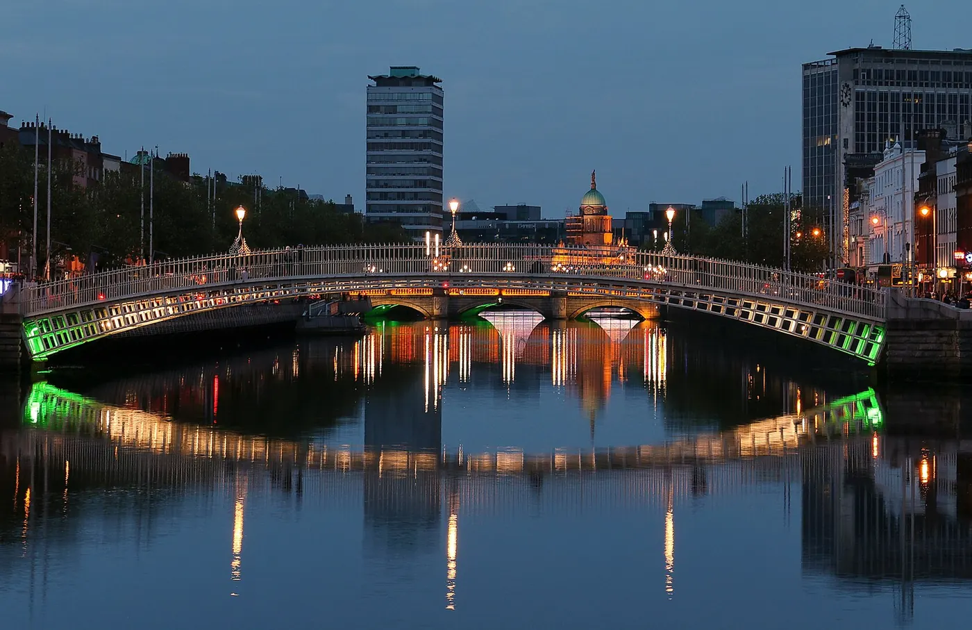 The Ha'penny Bridge over the River Liffey in Dublin at dusk