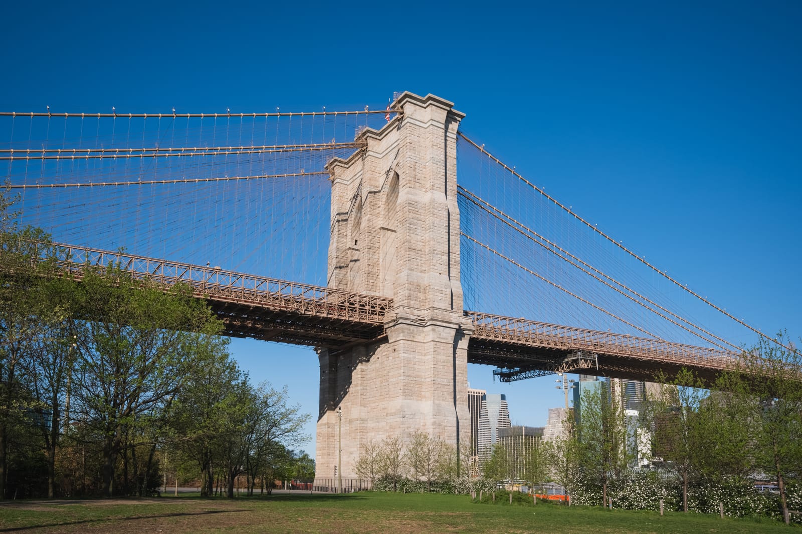 The Brooklyn-side stone tower of the Brooklyn Bridge, seen from Brooklyn Bridge Park