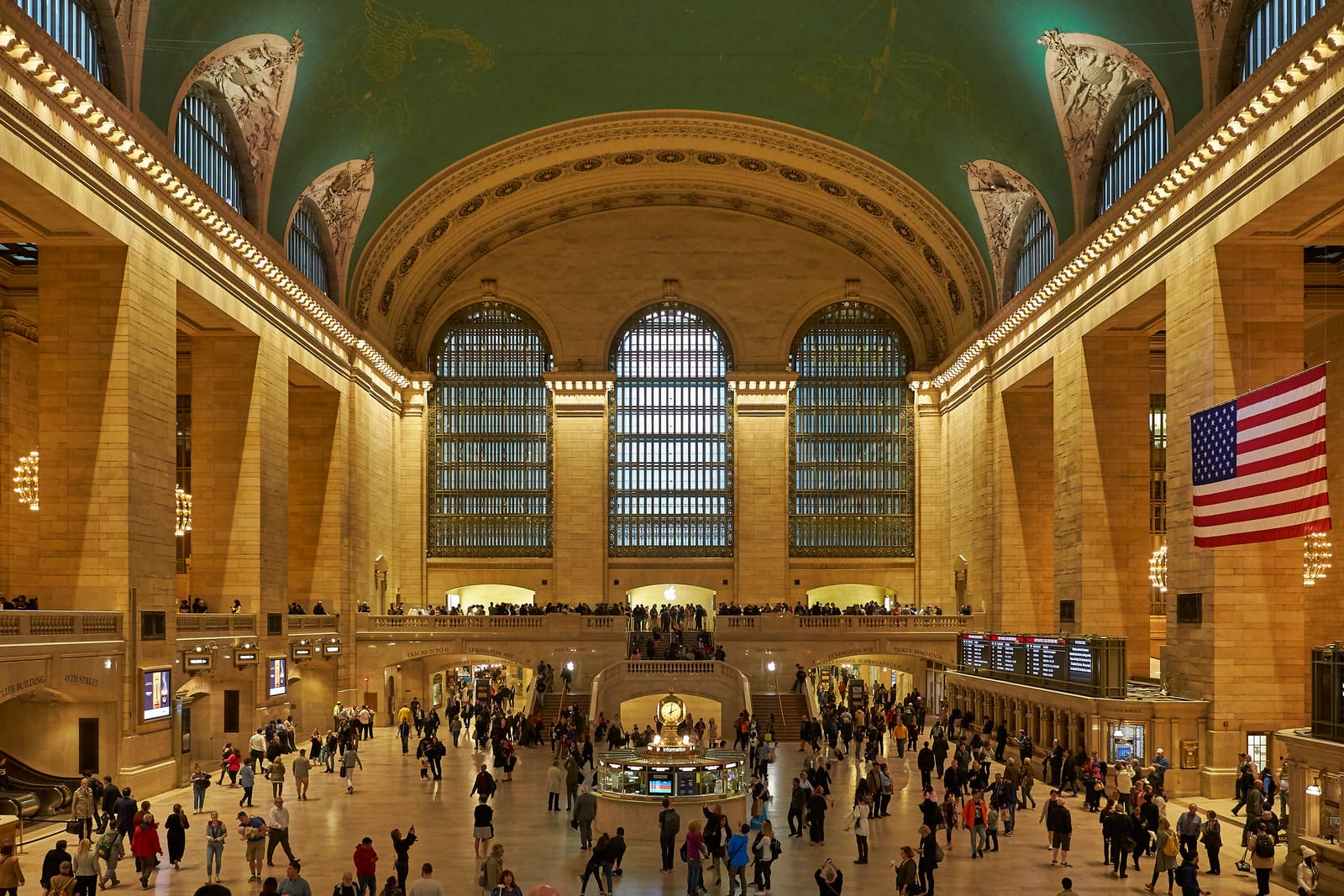 The main concourse of Grand Central Terminal, with its arched windows and the clock above the information booth